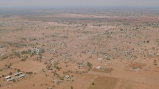 CAP_026_109 - HD stock footage aerial video of flying by an African village in Zimbabwe