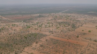 CAP_026_113 - HD stock footage aerial video of approaching an African village in Zimbabwe