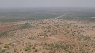 CAP_026_114 - HD stock footage aerial video of flying over an African village in Zimbabwe