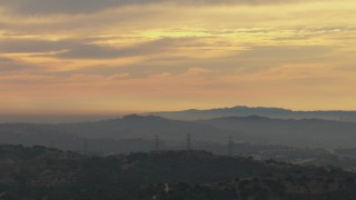 CBAX01_056 - HD aerial stock footage of clouds over Los Angeles Basin, seen from Chino Hills, California, sunset