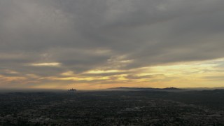 CBAX01_091 - HD aerial stock footage of downtown, Los Angeles Basin, clouds, Central Los Angeles, California, sunset