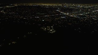 DCA01_005 - 5K aerial stock footage flying by the Griffith Observatory at night, Los Angeles, California