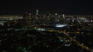 DCA01_011 - 5K aerial stock footage pan right revealing downtown Los Angeles skyline at night, California