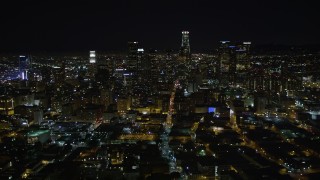 DCA01_015 - 5K stock footage aerial video flying away from Downtown Los Angeles skyline at night, California