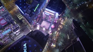 DCA01_036 - 5K stock footage aerial video orbiting bird's eye view of the Christmas fair at Nokia Theater at night, Los Angeles, California