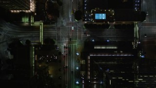 DCA01_040E - 5K stock footage aerial video bird's eye view following South Figueroa Street in Downtown Los Angeles at night, California