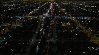 DCA01_062 - 5K aerial stock footage following Highway 110 in Los Angeles at night, California