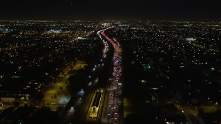 DCA01_068E - 5K aerial stock footage following I-105 at night, Hawthorne, California
