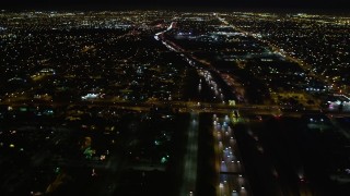 DCA01_070 - 5K aerial stock footage flying over I-105 and a residential neighborhood in Hawthorne at night, California