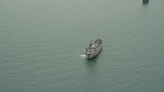 DCA02_008 - 4K aerial stock footage of a cargo ship on the South China Sea near the Outlying Islands, Hong Kong, China