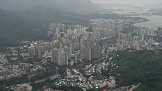 DCA02_028 - 4K aerial stock footage of apartment buildings in in Tai Po in the New Territories, Hong Kong, China
