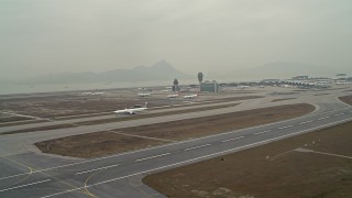 DCA02_035 - 4K aerial stock footage of passing commercial jets at Hong Kong International Airport, China