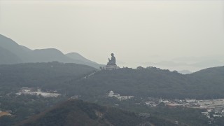 DCA02_039 - 4K aerial stock footage of Tian Tan Buddha statue on Lantau Island, Hong Kong, China