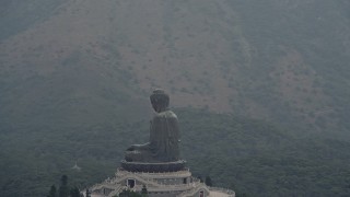 DCA02_040E - 4K aerial stock footage orbit the Tian Tan Buddha statue on Lantau Island, Hong Kong, China