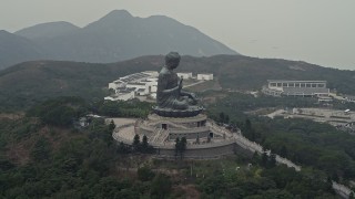DCA02_042 - 4K aerial stock footage of an orbit around the Tian Tan Buddha statue on Lantau Island, Hong Kong, China