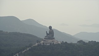 DCA02_043 - 4K aerial stock footage of orbiting around the Tian Tan Buddha statue on Lantau Island, Hong Kong, China