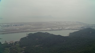 DCA02_045E - 4K aerial stock footage approach Hong Kong International Airport from  Lantau Island, Hong Kong, China