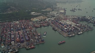 DCA02_056 - 4K aerial stock footage of barges and cargo containers at Pillar Point port, New Territories, Hong Kong, China