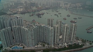 DCA02_059 - 4K aerial stock footage of waterfront apartments high-rises and Castle Peak Bay in New Territories, Hong Kong, China