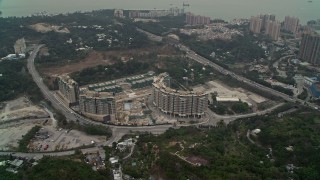 DCA02_063 - 4K aerial stock footage of Avignon Tower apartment complex in New Territories, Hong Kong, China