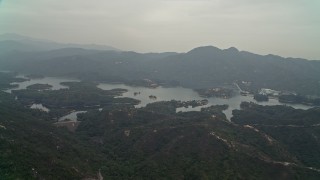 DCA02_064 - 4K aerial stock footage approach Tai Lam Chung Reservoir in New Territories, Hong Kong, China