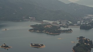 DCA02_065 - 4K aerial stock footage of Tai Lam Chung Reservoir and dam in New Territories, Hong Kong, China