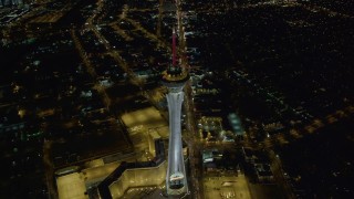 DCA03_004 - 4K aerial stock footage of approaching top of Stratosphere, Las Vegas, Nevada Night