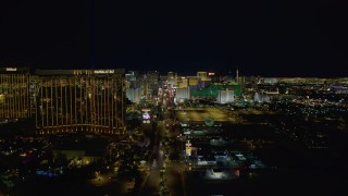 DCA03_013 - 4K aerial stock footage of Las Vegas Boulevard to Mandalay Bay, hotels and casinos in background, Las Vegas, Nevada Night