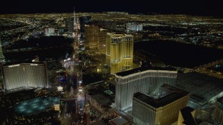 DCA03_021 - 4K aerial stock footage of panning across Las Vegas Boulevard, from Treasure Island to the Venetian, Las Vegas, Nevada, Night