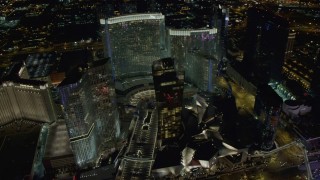 DCA03_031 - 4K aerial stock footage of flying by Aria Resort, Mandarin Oriental, Veer Towers, Las Vegas, Nevada Night