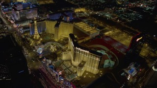DCA03_042 - 4K aerial stock footage video of Paris and Planet Hollywood Resort and Casino, Las Vegas, Nevada Night