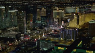 DCA03_058 - 4K aerial stock footage of flying toward Planet Hollywood, following Las Vegas Blvd, Las Vegas, Nevada Night