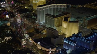 DCA03_063 - 4K aerial stock footage of panning across Imperial Palace, Harrah's, The Venetian, Las Vegas, Nevada Night