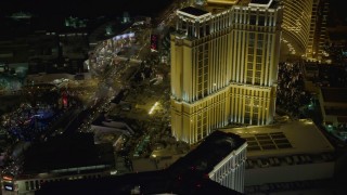 DCA03_065 - 4K aerial stock footage of flying by Palazzo from Las Vegas Boulevard, Las Vegas, Nevada Night