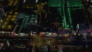 DCA03_071 - 4K aerial stock footage of Las Vegas Boulevard and the MGM Grand, Tropicana, Las Vegas, Nevada Night
