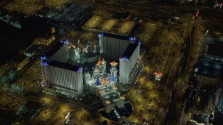 DCA03_074 - 4K aerial stock footage of flying away from Excalibur Hotel and Casino, Las Vegas, Nevada Night