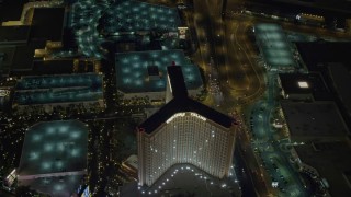 DCA03_079 - 4K aerial stock footage of flying by The Mirage, revealing Treasure Island, Las Vegas, Nevada Night