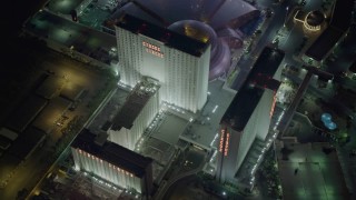 DCA03_081 - 4K aerial stock footage of orbiting Circus Circus while flying away, Las Vegas, Nevada Night