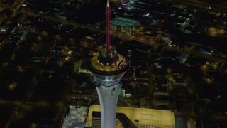 DCA03_083 - 4K aerial stock footage of orbiting top of Stratosphere, Las Vegas, Nevada Night