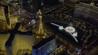 DCA03_130 - 4K stock footage aerial video of orbiting the water show at The Bellagio, Las Vegas, Nevada Night