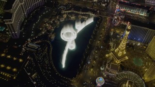 DCA03_131 - 4K aerial stock footage of orbiting the water show at The Bellagio, Las Vegas, Nevada Night