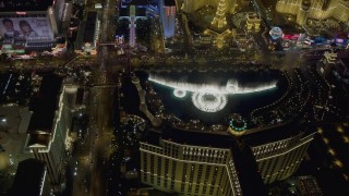 DCA03_132 - 4K aerial stock footage of orbiting the water show at The Bellagio, Las Vegas, Nevada Night