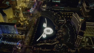 DCA03_133 - 4K aerial stock footage of orbiting the water show at The Bellagio, Las Vegas, Nevada Night