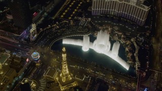 DCA03_134 - 4K aerial stock footage of orbiting The Bellagio fountain at the end of the show, Las Vegas, Nevada Night