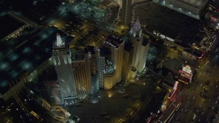 DCA03_144 - 4K aerial stock footage tilt to bird's eye view of New York New York Hotel and Casino, Las Vegas, Nevada Night