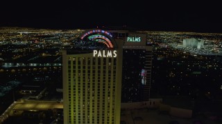 DCA03_152 - 4K aerial stock footage of approaching and orbiting Palms Casino Resort, Las Vegas, Nevada Night