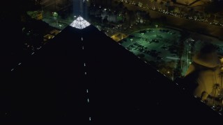 DCA03_162 - 4K aerial stock footage of flying by top of Luxor Hotel and Casino, Las Vegas, Nevada Night