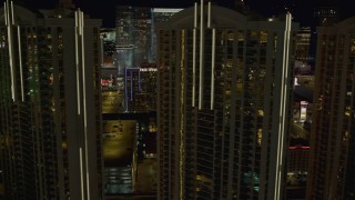 DCA03_167 - 4K aerial stock footage of flying by the Signature at MGM Grand, Las Vegas, Nevada Night