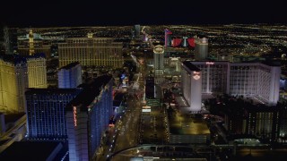 DCA03_169 - 4K aerial stock footage of flying behind Bally's and Flamingo, Las Vegas, Nevada