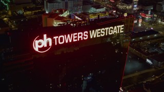 DCA03_204 - 4K aerial stock footage approach and orbit Planet Hollywood Towers Westgate, Las Vegas, Nevada Night